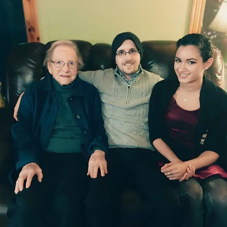 William Horschak seated between his great-grandmother Stella and his life partner D’Mytria